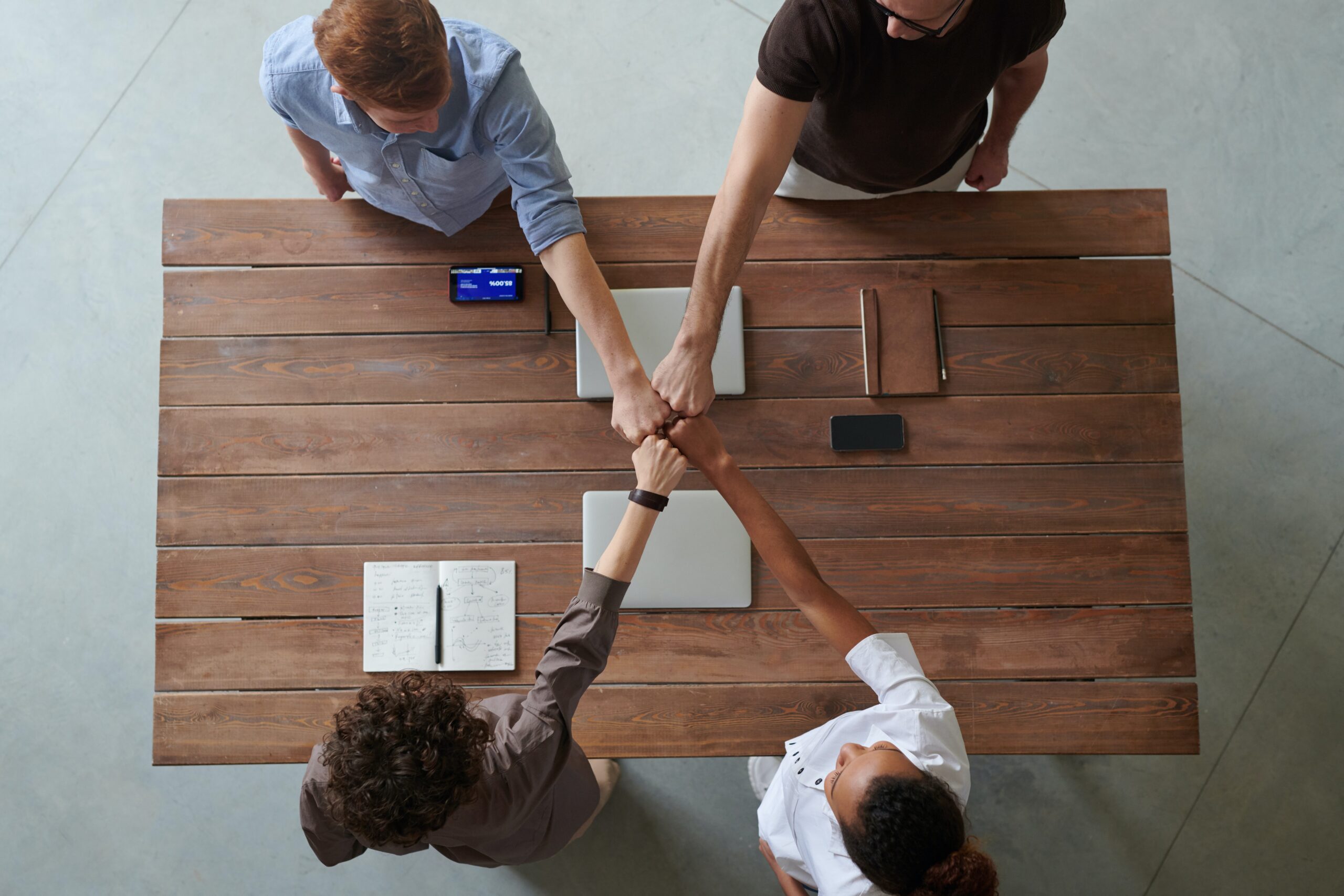 Photo of people doing a fist bump